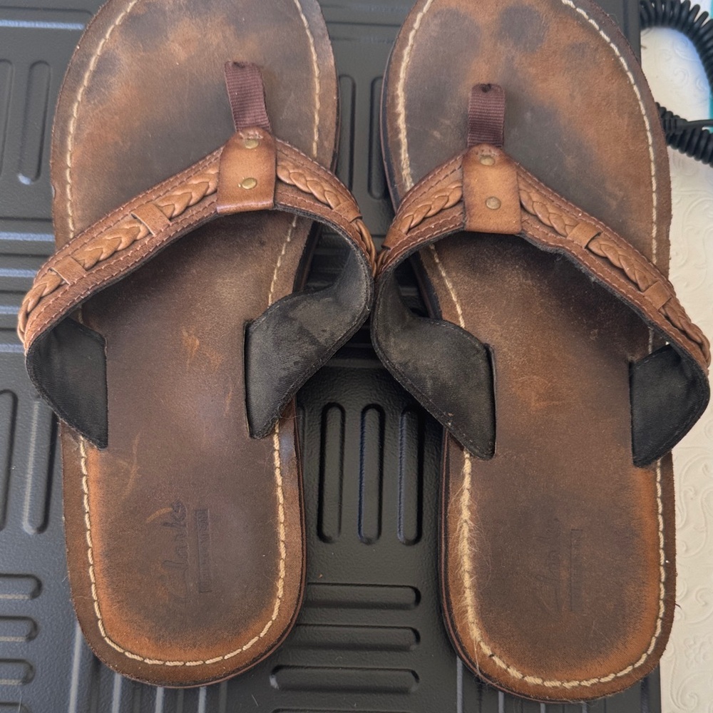 Clarks Tan and Black Woman’s  Flip-Flops